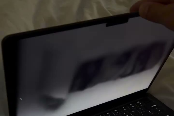 Desktop blurred, folding into the hinge